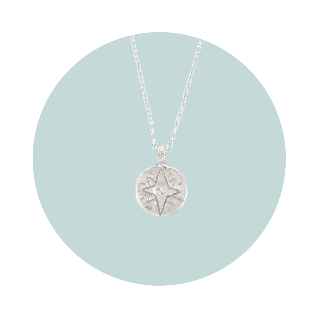 Recycled silver North Star pendant necklace with moonstone June birthstone, flush set to symbolise intuition, harmony and new beginnings.
