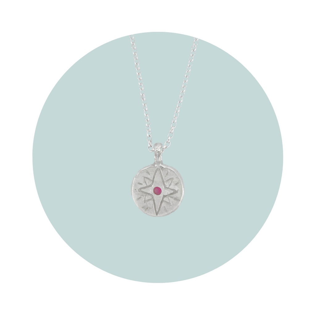 Recycled silver North Star pendant necklace with pink tourmaline October birthstone, flush set to symbolise compassion, love and emotional healing.